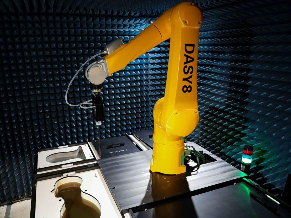 Robotic cutting system trimming a composite preform